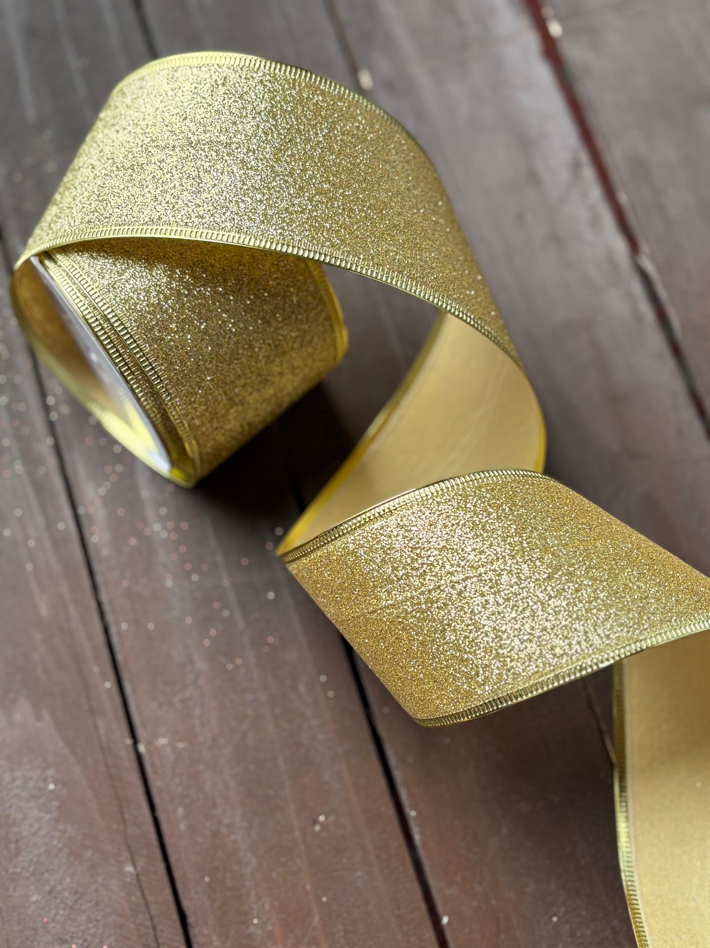 63mm GLITTERED GOLD FABRIC WIRED EDGE RIBBON x 10yrds