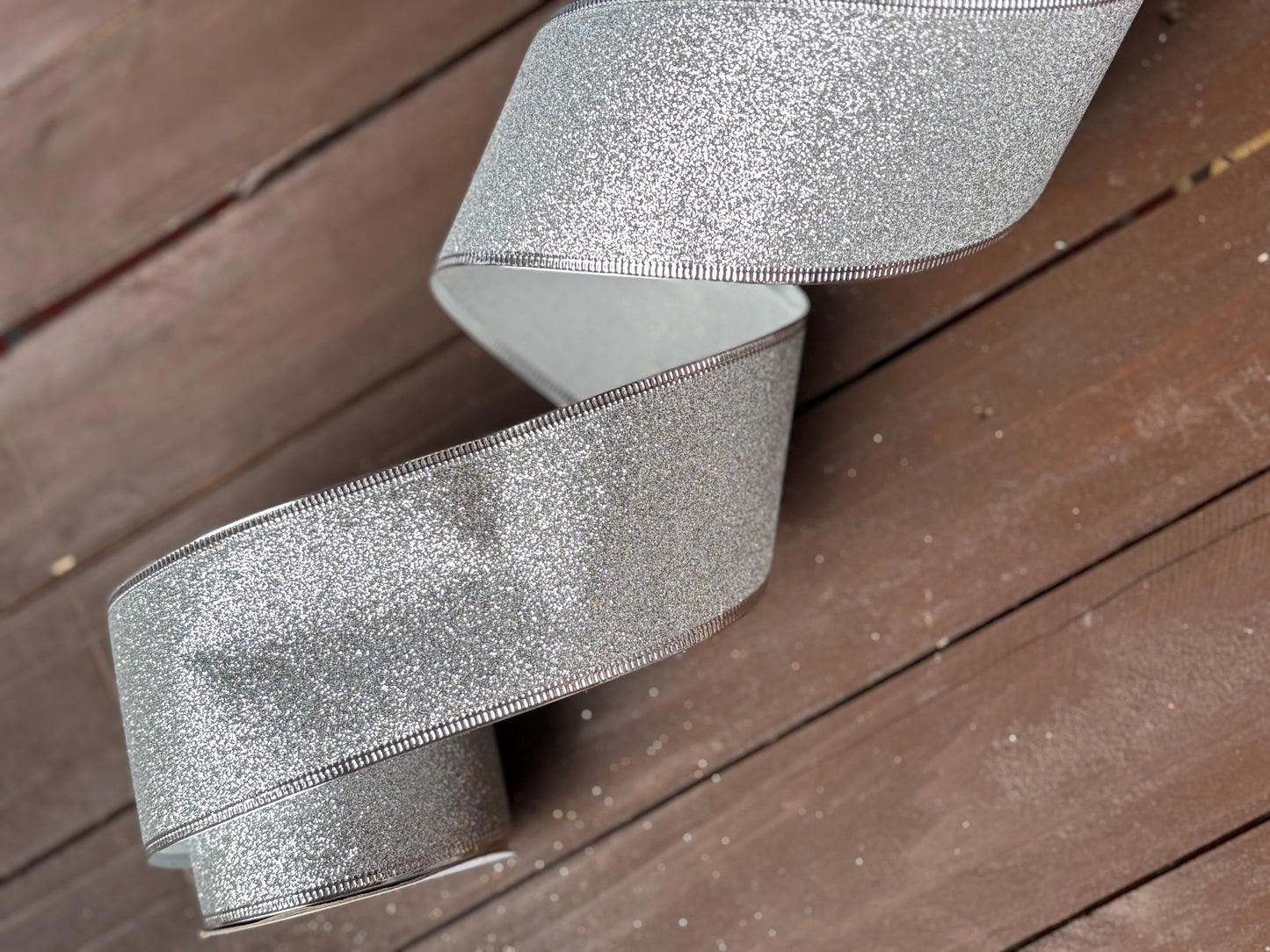 63mm GLITTERED SILVER FABRIC WIRED EDGE RIBBON x 10yrds