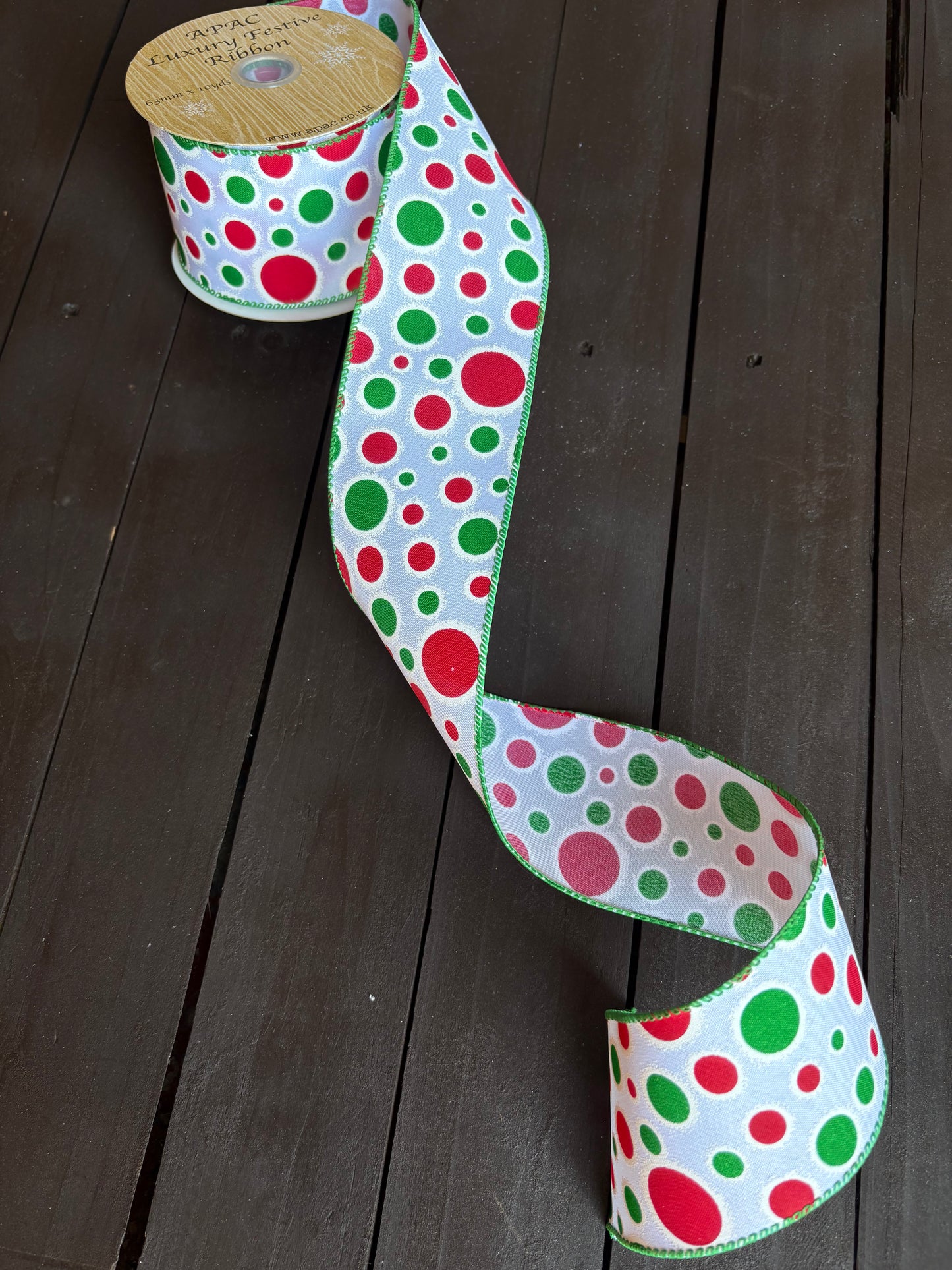 WIRED SATIN RED RIBBON WITH GLITTERED GREEN DOTS 63mm x 10m