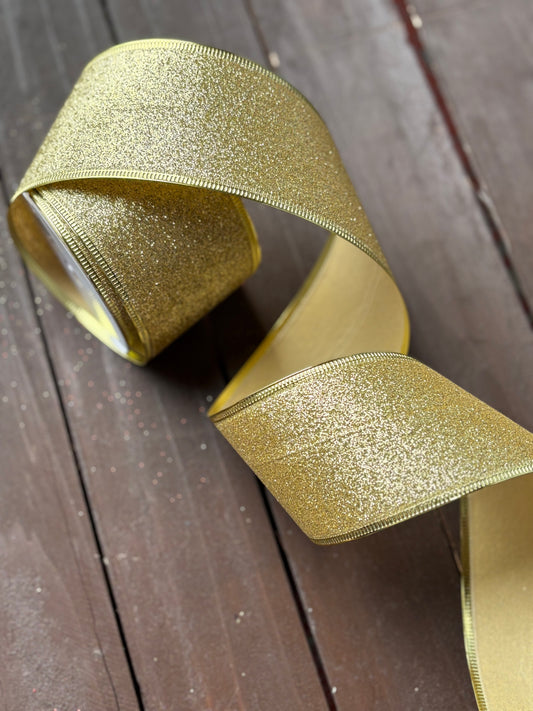 63mm GLITTERED GOLD FABRIC WIRED EDGE RIBBON x 10yrds